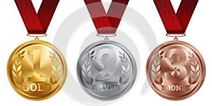 A set of gold, silver and bronze medals, the first, second and third place. Winner, champion, number one, two, three. Red ribbon.