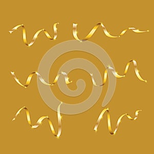 A set of gold yellow expensive luxury ribbons lines, serpentine for the new year, Christmas is isolated on a yellow background photo