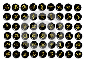 A set of golden alchemical symbols carved on stone isolated on
