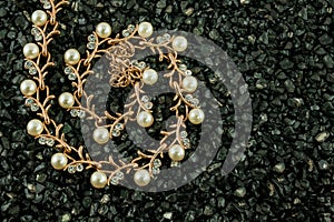 Set of golden bracelet with diamonds over black background
