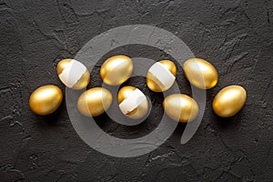 Set of golden eggs. Easter decoration. Wealth and good luck concept. Overhead view