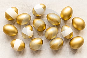 Set of golden eggs. Easter decoration. Wealth and good luck concept. Overhead view