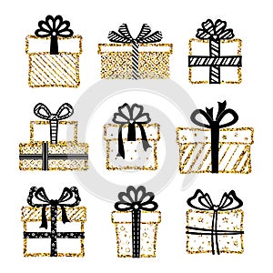 Set of golden glitter gift boxes with black ribbons