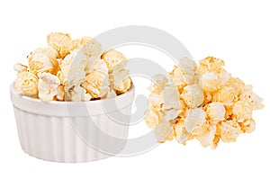 Set of golden popcorn as heap and in ceramics bowl isolated on white background.