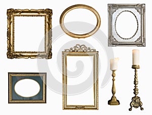 Set of golden vintage frame adn candlesticks isolated on white background.