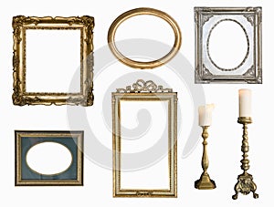 Set of golden vintage frame adn candlesticks isolated on white background. photo