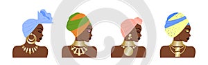 Set of gorgeous African women in a national headdress and with gold jewelry