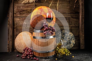 Set of grape, wine and various types of cheese on brown wooden background