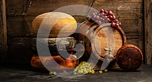 Set of grape, wine and various types of cheese on brown wooden background, Long banner format