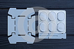 a set of gray metal portable burner packs with white dry alcohol fuel