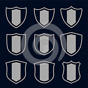 Set of gray shield symbols and signs