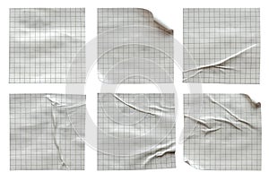 A set of Gray square grid pattern small glued crumpled and creased note memo paper isolated on white background