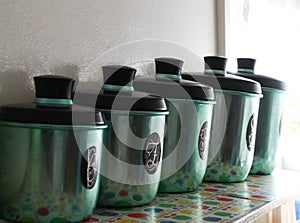 Set of green anodized antique kitchen canisters
