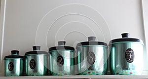 Set of green anodized antique kitchen canisters