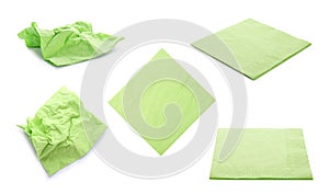 Set with green paper napkins on background