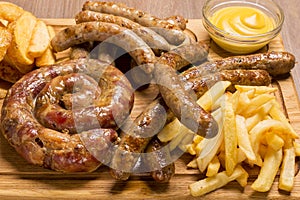 Set of grilled sausages a wooden board hunting sausages, pork sausages