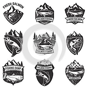 Set of grunge badges with salmon fish. Design elements for logo, label, emblem, poster, t-shirt. Vector illustration.