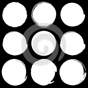 Set of grungy circles. Monochrome circle shapes w/ textured edge photo