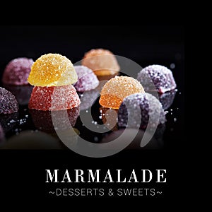 Set of gummy marmalade desserts isolated on black background. Close-up to Colourful sweets with reflection and berry flavours.
