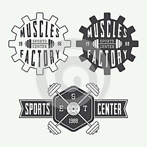 Set of gym logos, labels and slogans in vintage style