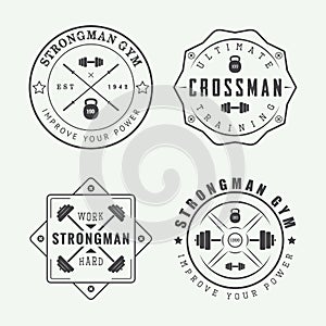 Set of gym logos, labels and slogans in vintage style