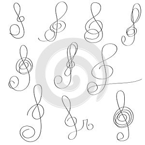 Set of hand drawn scribble  treble clefs. Collection of abstract treble clefs in doddles style. Design element. photo