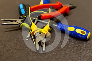 Set of hand metal tools close-up of a bunch of objects repairing workshop pliers screwdriver close-up