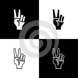 Set Hand showing two finger icon isolated on black and white background. Hand gesture V sign for victory or peace