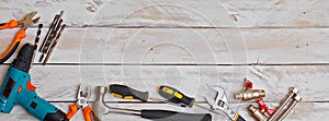 Set of hand tools on wooden background with copy space, suitable for header or banner