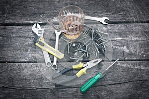 Set of hand tools on a wooden background.