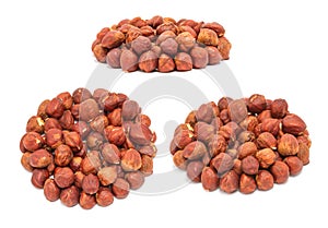 Set of handfuls of nuts from different angles - peeled ripe hazelnuts closeup