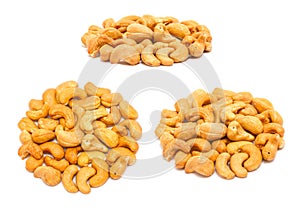 Set of handfuls of nuts from different angles - roasted cashew Anacardium occidentale without shell
