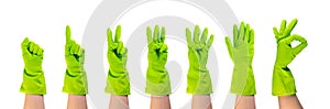 Set of hands in green protective rubber gloves isolated