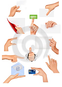 Set of hands holding different business objects.