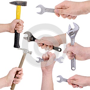 Set of hands holding working tools