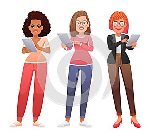 A set of happy young women holding a tablet computer in their hands. Internet surfing and working in a mobile application