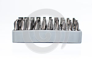 Set of heads for screwdriver in grey box isolated on white background