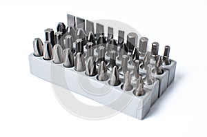 Set of heads for screwdriver in grey box isolated on white background