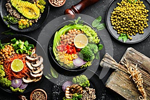 A set of healthy food on a black stone table. Bowl Buddha. Top view.