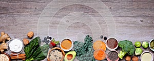 Set of healthy food ingredients. Top view bottom border on a wood banner background. Copy space.