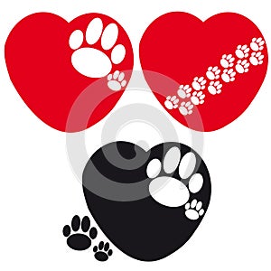 Set of hearts with dog paws on white background photo