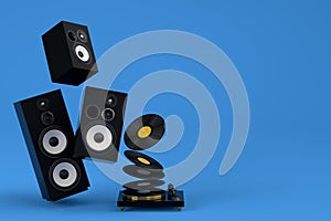 Set of Hi-fi speakers and DJ turntable for sound recording studio on blue.