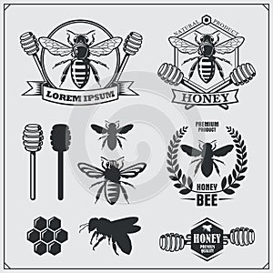 Set of honey labels, badges and design elements. Honeycombs, bees, honey emblems.