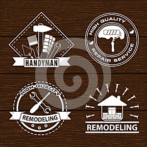 Set of house renovation labels and home remodeling logos. Handyman logo on wooden background.