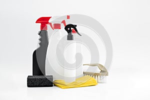 Set of household chemicals for cleaning on a white background. washcloth, gloves, bottles with detergents close-up.