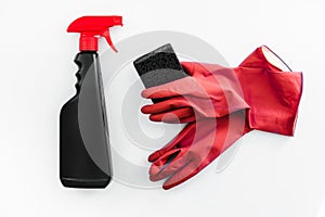 Set of household chemicals for cleaning on a white background. washcloth, gloves, bottles with detergents close-up