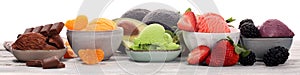 Set of ice cream scoops of different colors and flavours with berries, chocolate and fruits