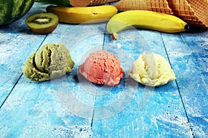 Set of ice cream scoops of different colors and flavours with berries and fruits