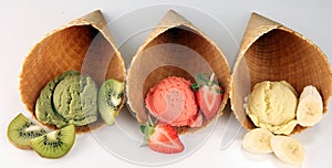 Set of ice cream scoops of different colors and flavours with berries and fruits