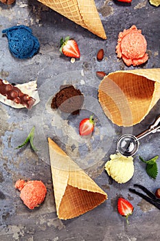 Set of ice cream scoops of different colors and flavours with berries and fruits